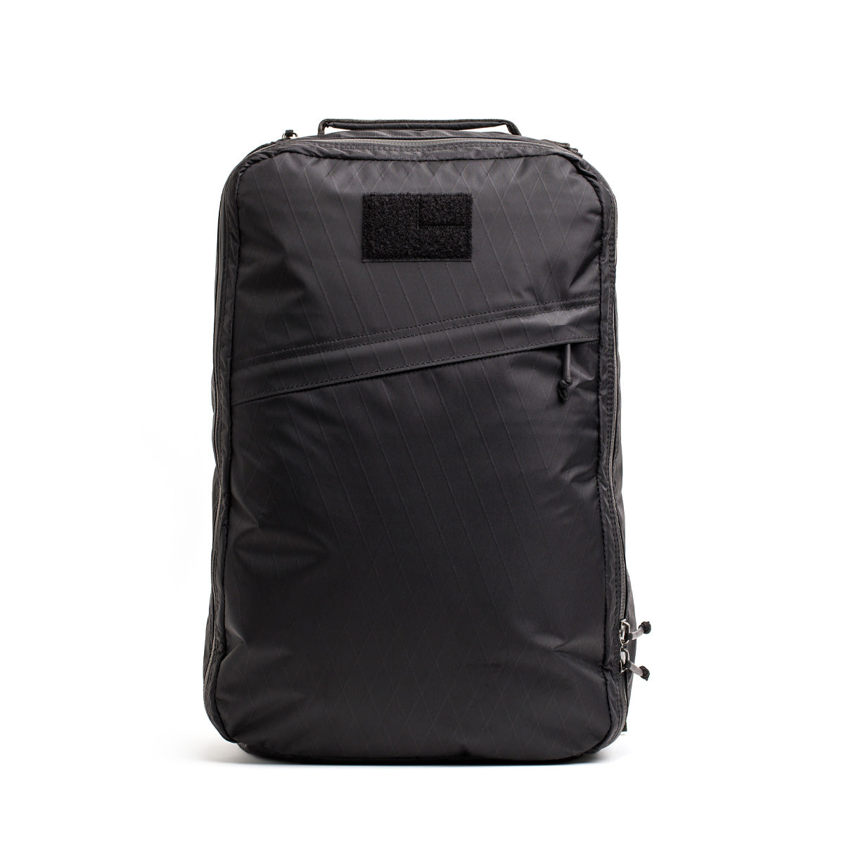 Introducing the GR1 USA - X-PAC by GORUCK, a sleek black backpack constructed from waterproof X-PAC material, featuring a discreet front zipper pocket and a convenient top handle.