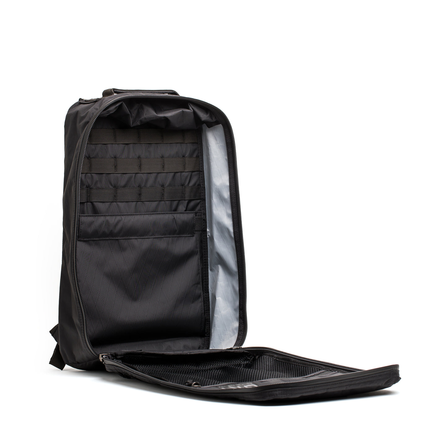 Open the GR1 USA - X-PAC black rucksack by GORUCK, featuring expertly organized interior compartments and zippers, crafted from waterproof X-PAC material.