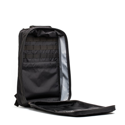 The open GR1 USA - X-PAC black backpack showcases organized compartments and pockets, crafted from durable X-PAC material for waterproof protection.