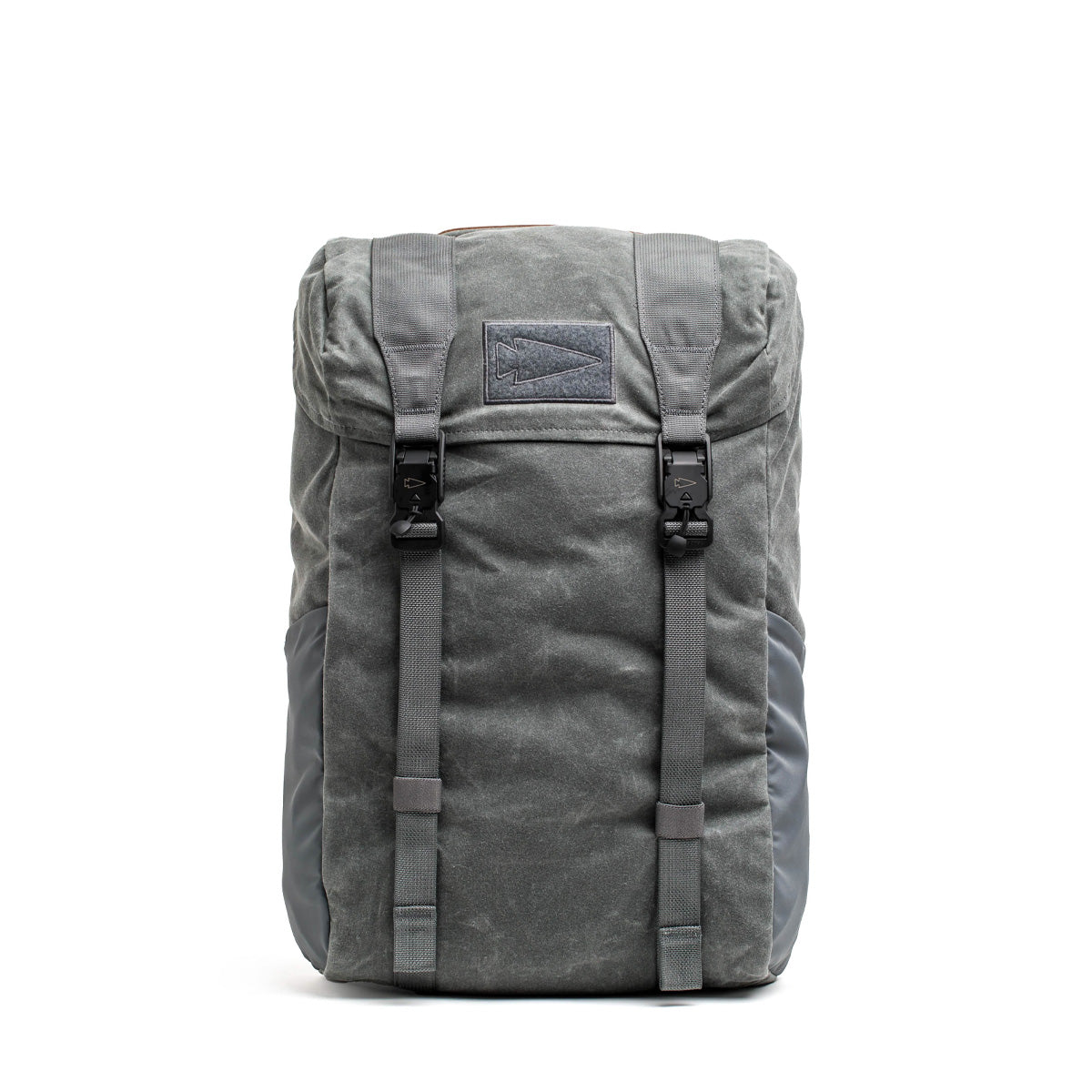 The M24 - Waxed Canvas is a modern rucksack with a gray minimalist design, two front buckles, and a top flap. Crafted from durable materials, it stands out against a plain white background.