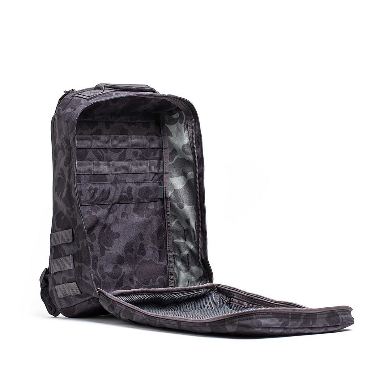 The GR1 USA - Cordura (The Original Ruck) backpack, made from Special Forces-grade materials, includes multiple compartments and zippers. It stands upright on a plain background, primed for any GORUCK Challenge.