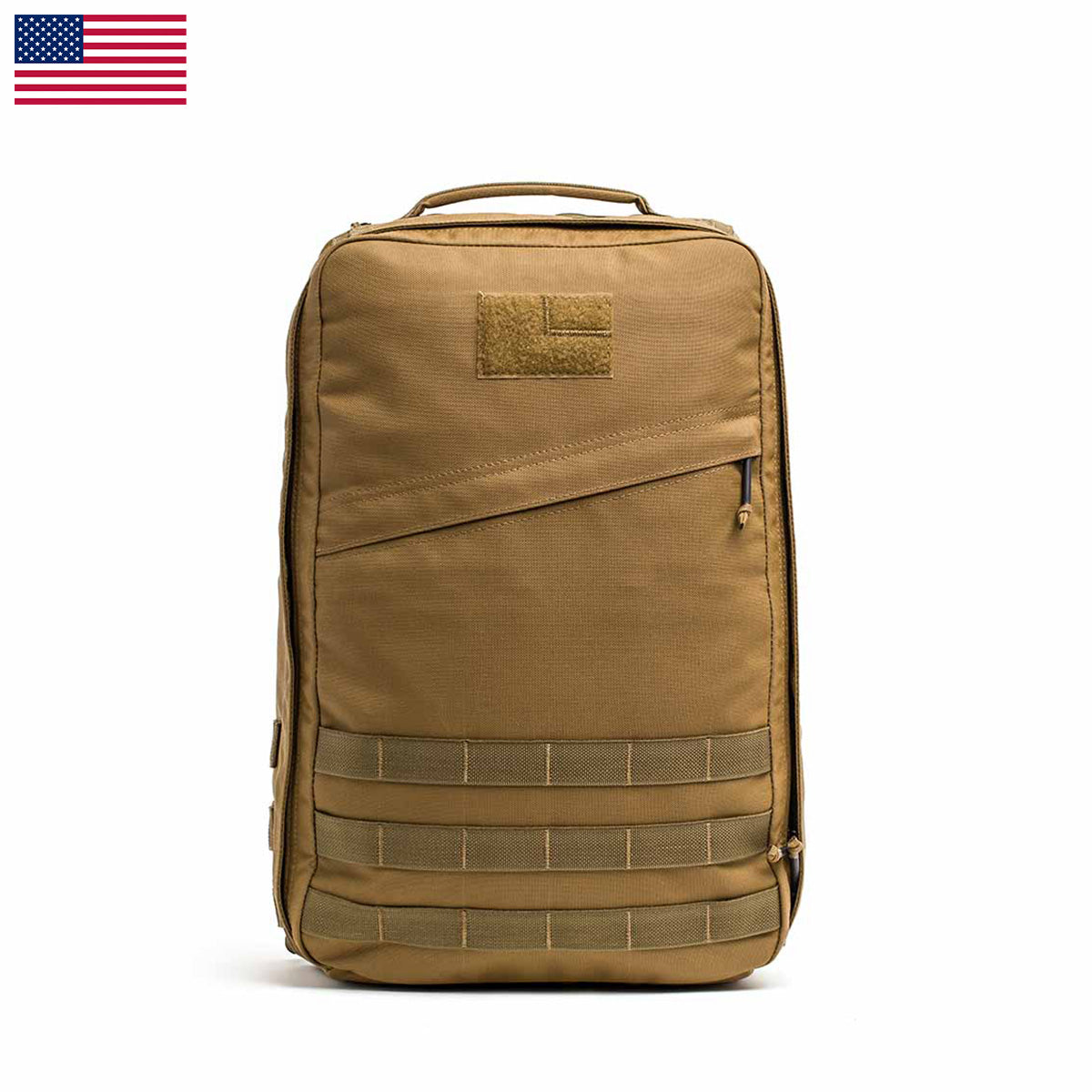 The GR1 USA - Cordura (The Original Ruck) is a tan tactical backpack with multiple compartments and MOLLE webbing, reminiscent of a Special Forces rucksack. It proudly displays an American flag in the top left corner and is perfect for the GORUCK Challenge due to its durability and versatility.