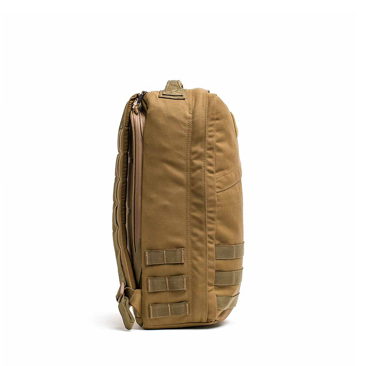 The GR1 USA - Cordura (The Original Ruck), a tan tactical backpack with side straps and a top handle, is showcased from the side against a white background.