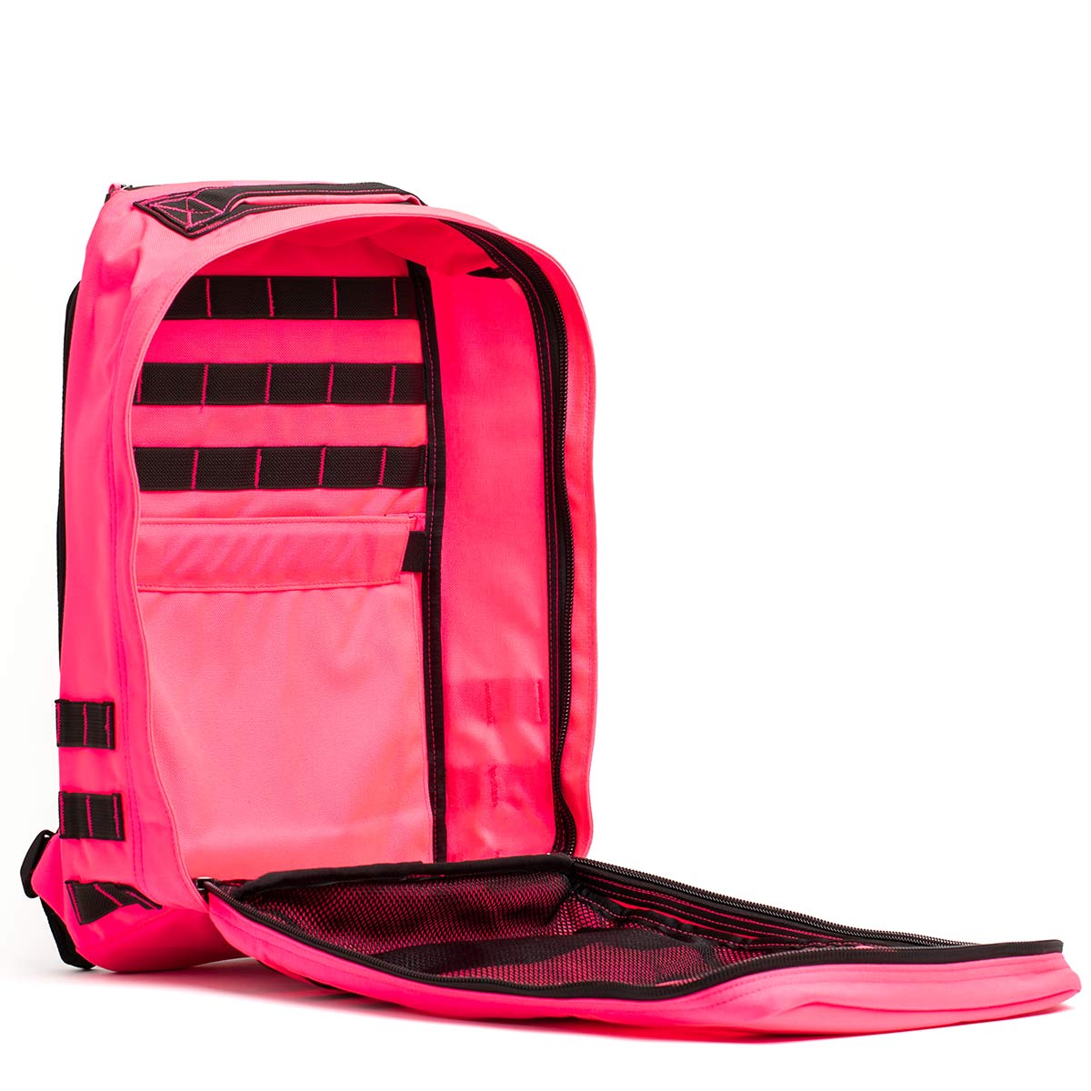 The GR1 USA - Hot Pink backpack by GORUCK boasts an open front flap showcasing a variety of black pockets and compartments. Engineered for durability and high performance, it includes external black straps and handles. The interior is structured for storage akin to a Special Forces pack.