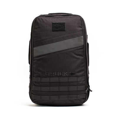 The Rucker 4.0 by GORUCK is a sleek, modern black rucksack that features a diagonal stripe and a small logo patch near the top, with the brand name embossed on the front. Ideal for rucking enthusiasts, it includes multiple compartments and durable fabric designed to withstand any adventure.