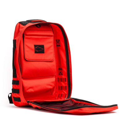 The Rucker 4.0 by GORUCK is a red backpack designed for rucking, featuring multiple compartments. It opens to reveal interior pockets and black accents, making it your gym on your back.