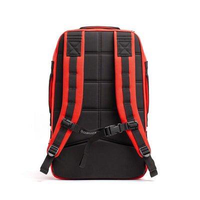 The Rucker 4.0 by GORUCK, seen from the back, features padded straps and an adjustable chest buckle, making it perfect for rucking adventures with its black and red design.