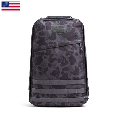 The GR1 USA - Cordura (The Original Ruck), inspired by Special Forces, offers multiple compartments. Against a white background with a USA flag in the corner, it's ideal for your next GORUCK Challenge.