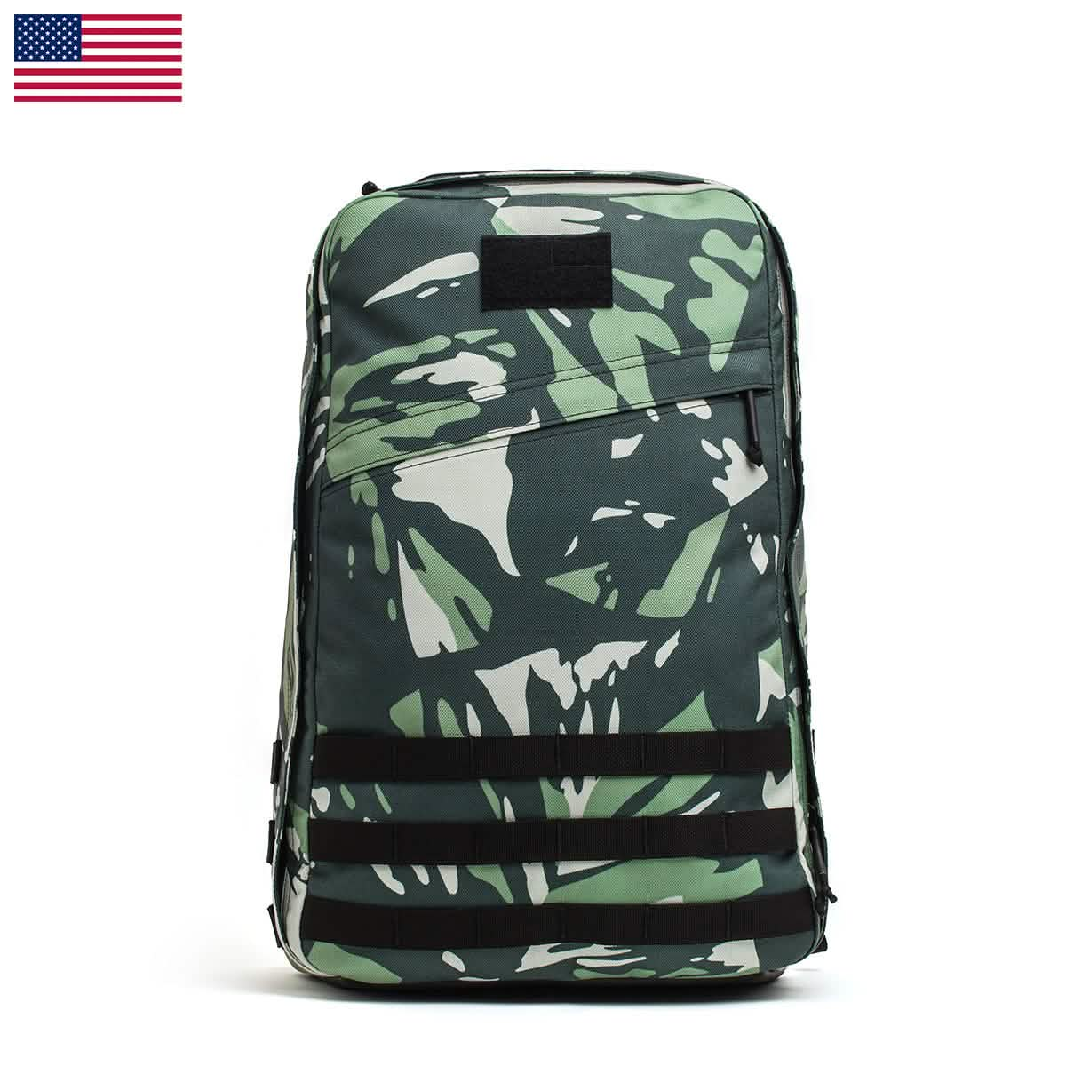 The GR1 USA - Cordura (The Original Ruck) is a camouflage backpack made from Special Forces grade materials. It features black straps and an American flag icon on a white background, ideal for GORUCK Challenges or sporting the iconic GR1 design.