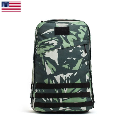 The GR1 USA - Cordura (The Original Ruck) is a camouflage backpack made from Special Forces grade materials. It features black straps and an American flag icon on a white background, ideal for GORUCK Challenges or sporting the iconic GR1 design.