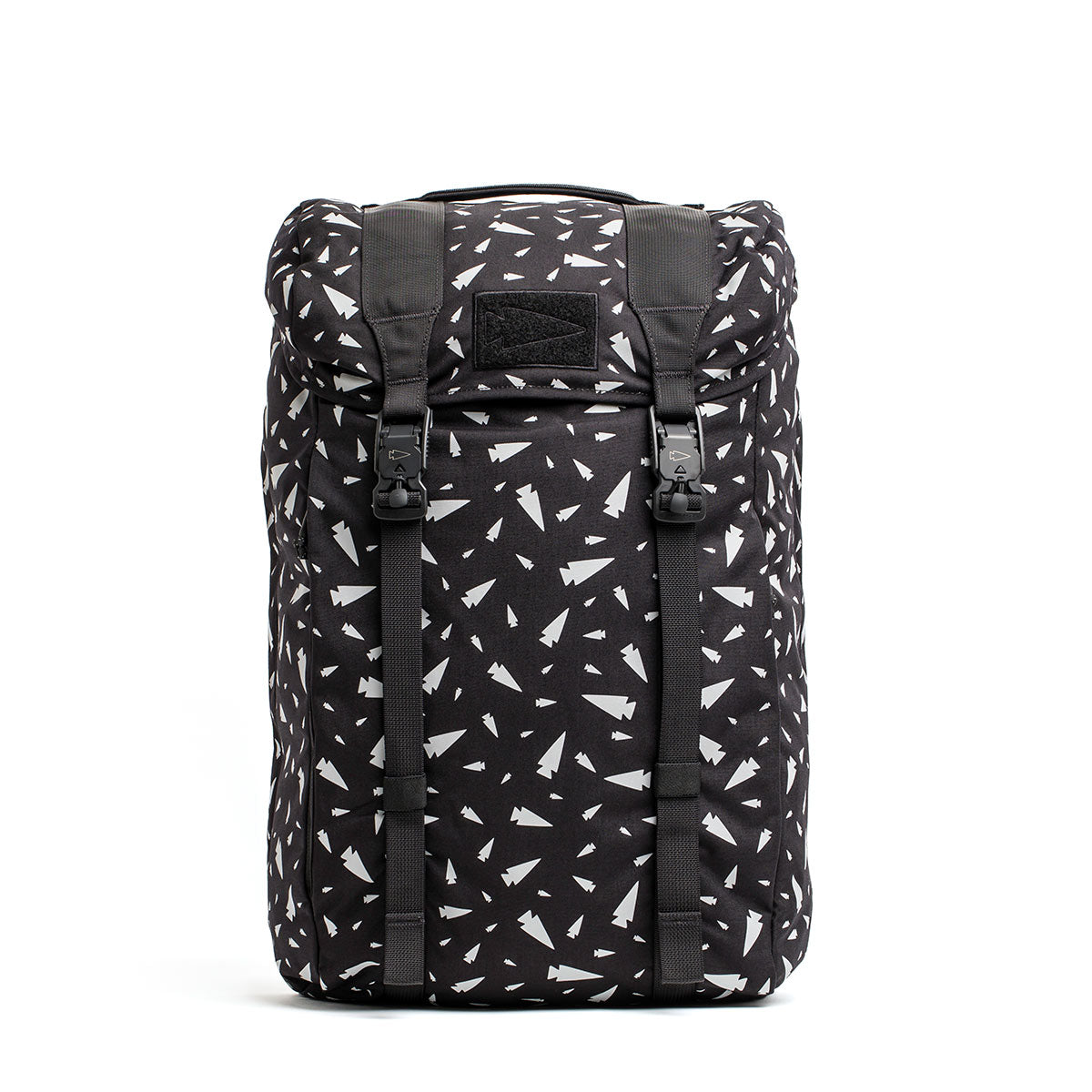 The M23 - Cordura - Spearhead Shrapnel by GORUCK is a black rucksack with a drawstring top and buckles, adorned with a pattern of small white airplane icons evenly distributed across its durable material.