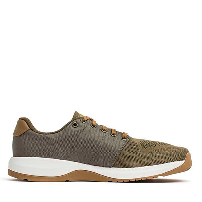 A sneaker in Ranger Green and Coyote Reflective Spearhead with a white sole, showcasing a mesh upper and tan laces. Designed by GORUCK, the Women's Ballistic Trainers are crafted from CORDURA® Ballistic Nylon for enhanced durability and modern casual appeal, making them perfect for functional fitness activities. It's stylishly displayed from the side.