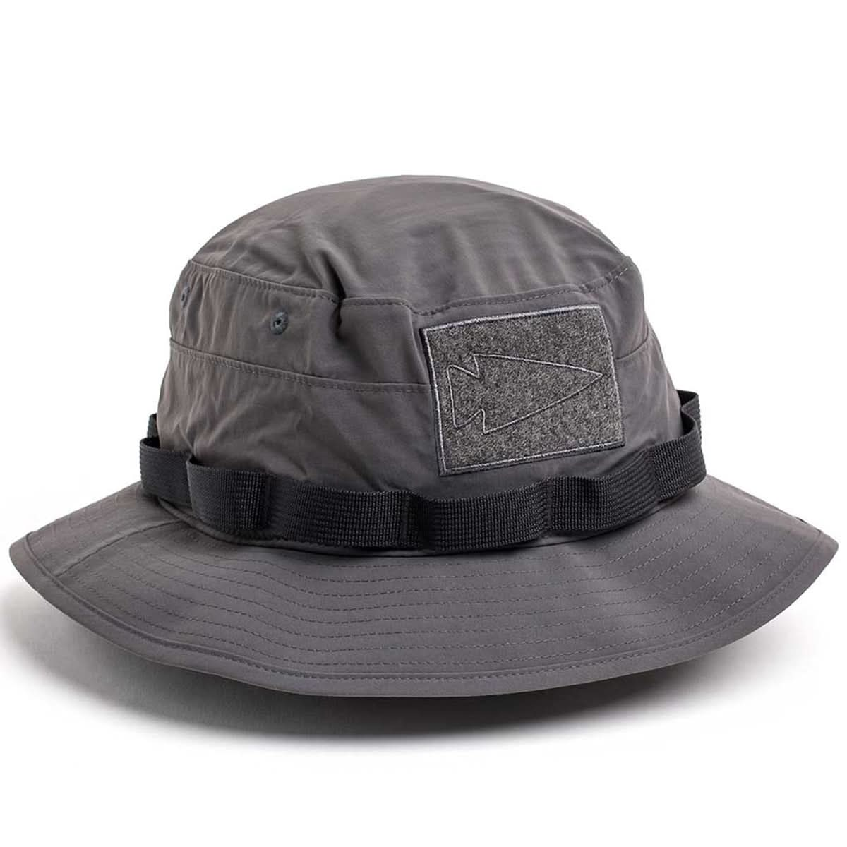 The Boonie Hat - Tactical - ToughDry is a gray military-style hat with a black band, arrowhead patch on the side, and is crafted from ToughDry® fabric for lasting durability.