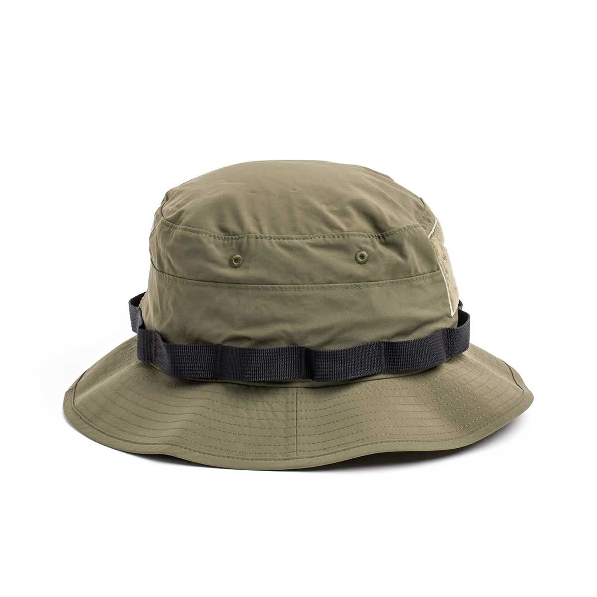 The Boonie Hat - Tactical - ToughDry is a military-style olive green bucket hat with a black band, crafted from ToughDry® fabric for durability. Its side view highlights its rugged charm and practical design.