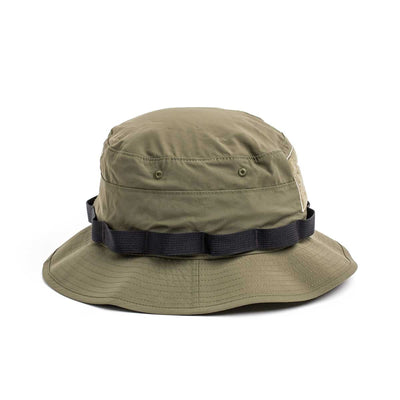 The Boonie Hat - Tactical - ToughDry is a military-style olive green bucket hat with a black band, crafted from ToughDry® fabric for durability. Its side view highlights its rugged charm and practical design.