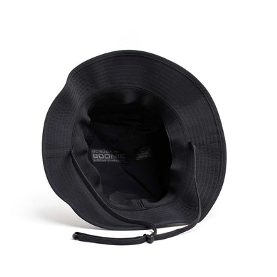 The Boonie Hat - Slick - ToughDry is a black hat featuring ToughDry® fabric and a chin strap, viewed from above to showcase interior branding and stitching for enhanced protection from the elements.