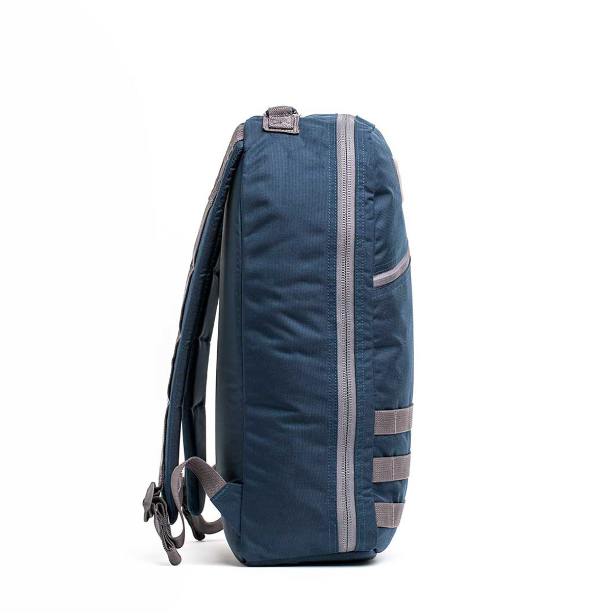 Side view of a Bullet Ruck Classic - Cordura in blue, featuring gray straps and multiple side loops; 15L capacity.