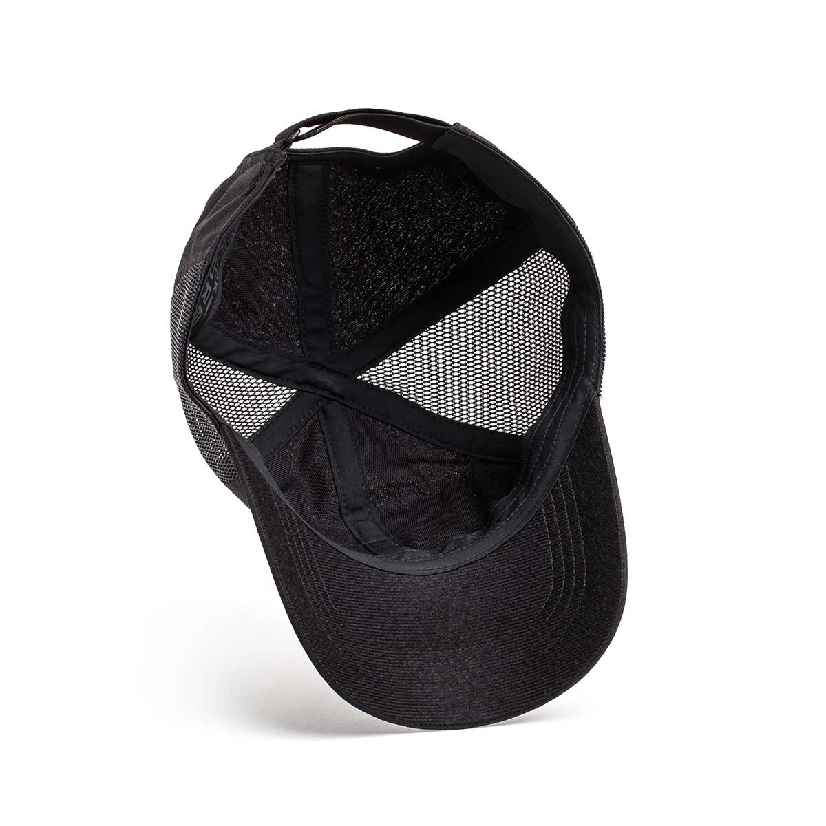 The Cadre Hat - CORDURA® features intricate stitching and durable 500D CORDURA® mesh details on the interior, highlighted through a black mesh baseball cap with a curved brim.