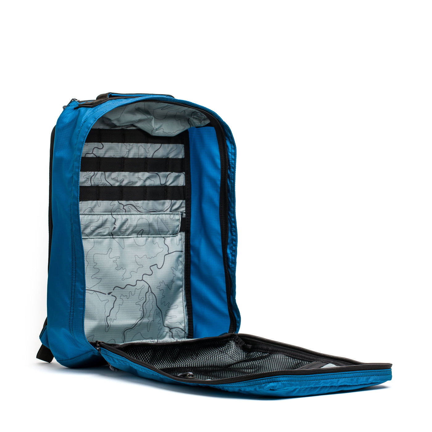 The GR1 USA - Ripstop ROBIC® by GORUCK is an open blue backpack made from ultra-lightweight 420D Robic Ripstop Nylon, featuring a map print interior and a black mesh pocket.