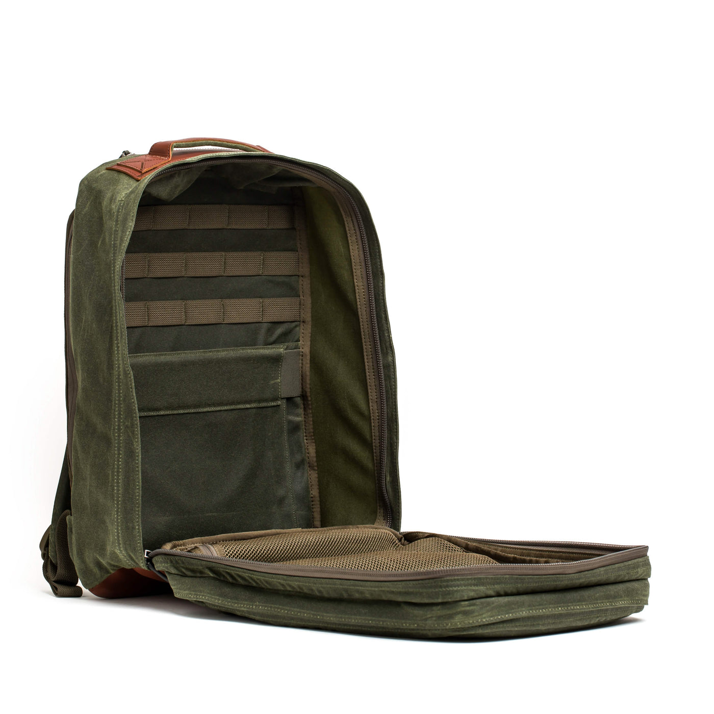 A green GR2 - Waxed Canvas rucksack from GORUCK with multiple compartments, displayed open at a 90-degree angle. It includes inner pockets and elastic straps for organization, boasting a sleek, modern design with a brown Red Wing Leather accent on top.