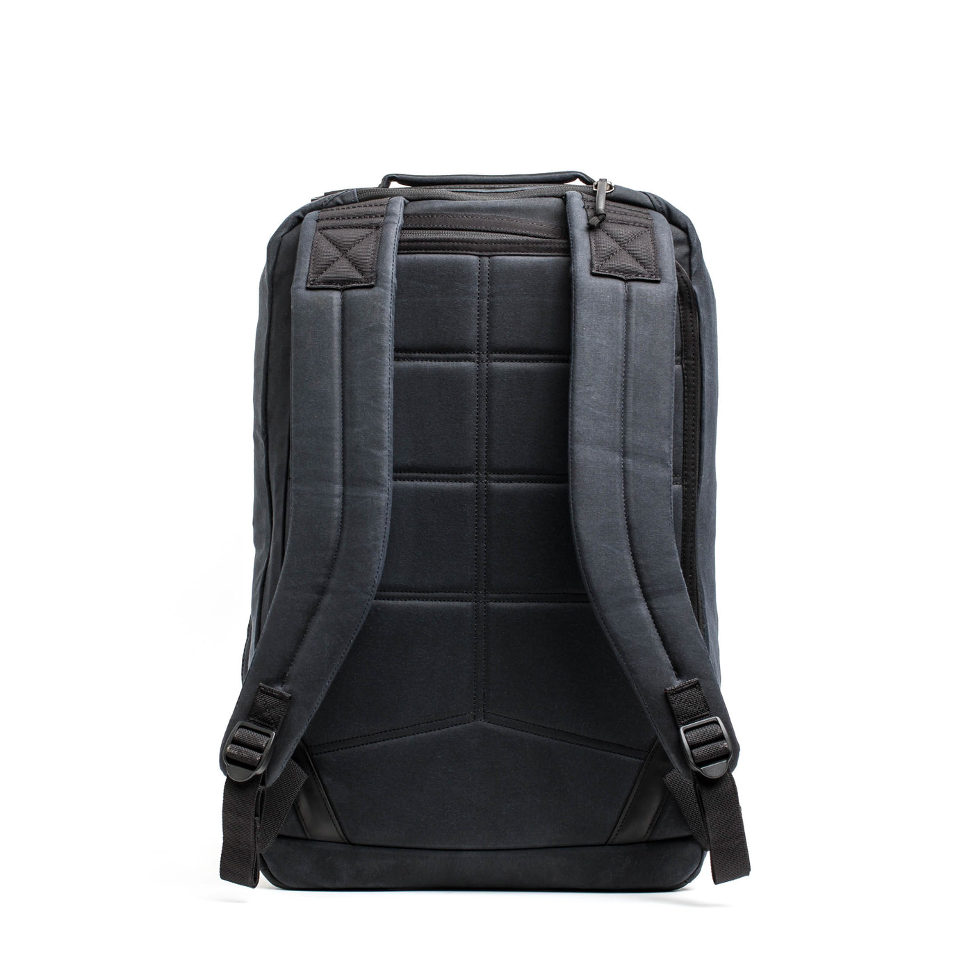 The GR2 - Waxed Canvas backpack by GORUCK is presented from the back, showcasing its padded shoulder straps and stitched detailing. Made from waxed duck canvas, this black bag appears structured and features a top handle, set against a plain white background, embodying the timeless style of a heritage retro rucksack.