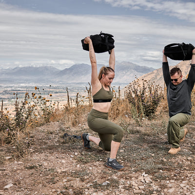 Man and Woman working out. Woman in Cropped Training Leggings Pocket Ranger Green