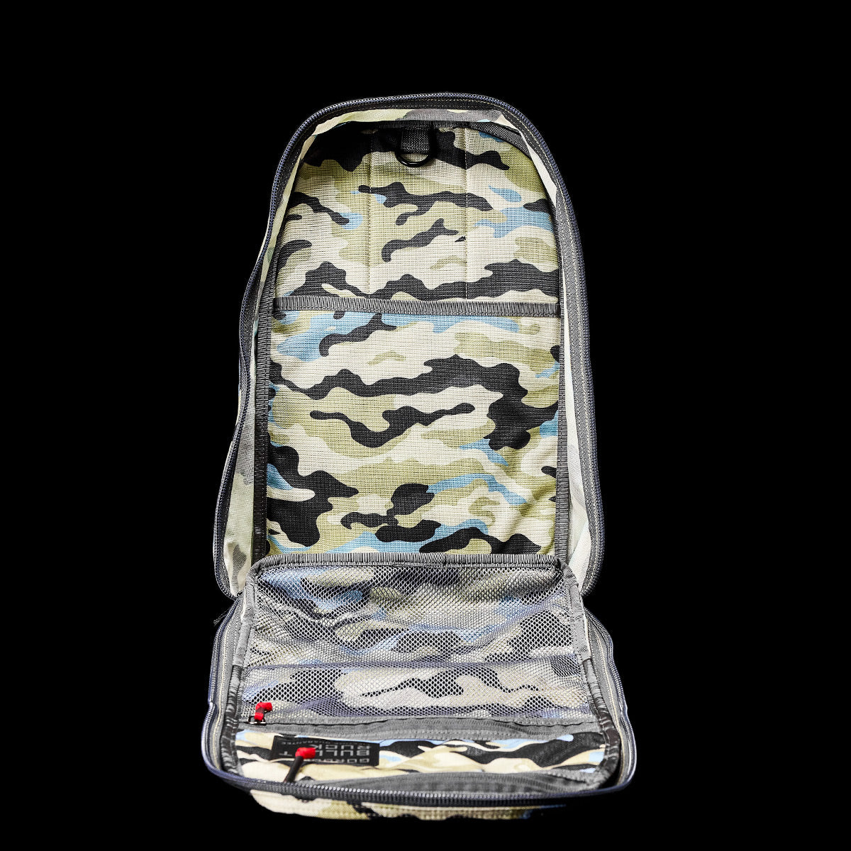 Open the Bullet Ruck Classic - Cordura by GORUCK on a black background, showcasing camouflage patterns with mesh compartments and padded straps for a streamlined design.