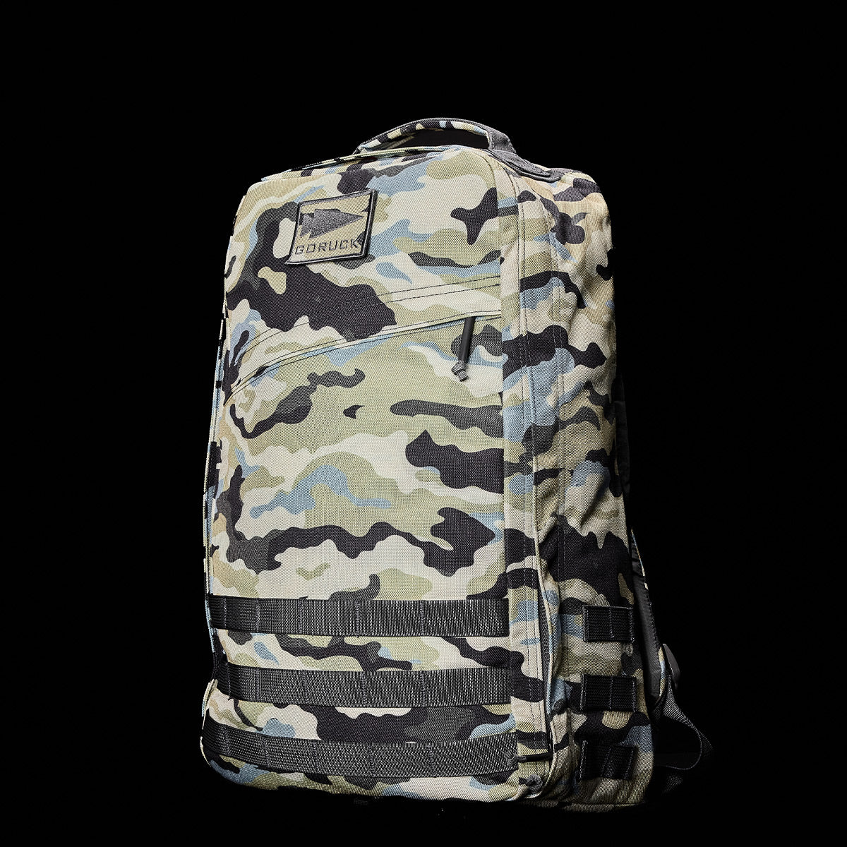 The GR1 USA - Cordura (The Original Ruck) by GORUCK is a Special Forces-inspired backpack featuring a camouflage pattern with multiple zippered compartments against a sleek black background.