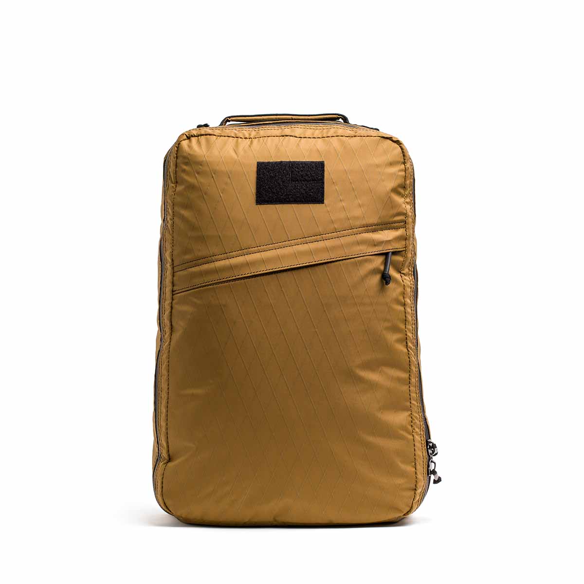 The GR1 USA - X-PAC rucksack comes in mustard yellow, with a front zipper pocket and a top black handle, crafted from X-PAC material for exceptional durability.