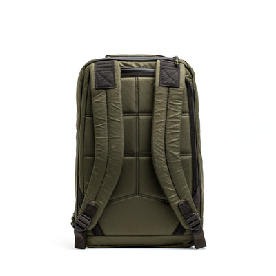 The GORUCK GR1 USA - X-PAC, a highly durable green backpack, is made from waterproof X-PAC fabric and features padded shoulder straps and a quilted back panel, shown from the rear.