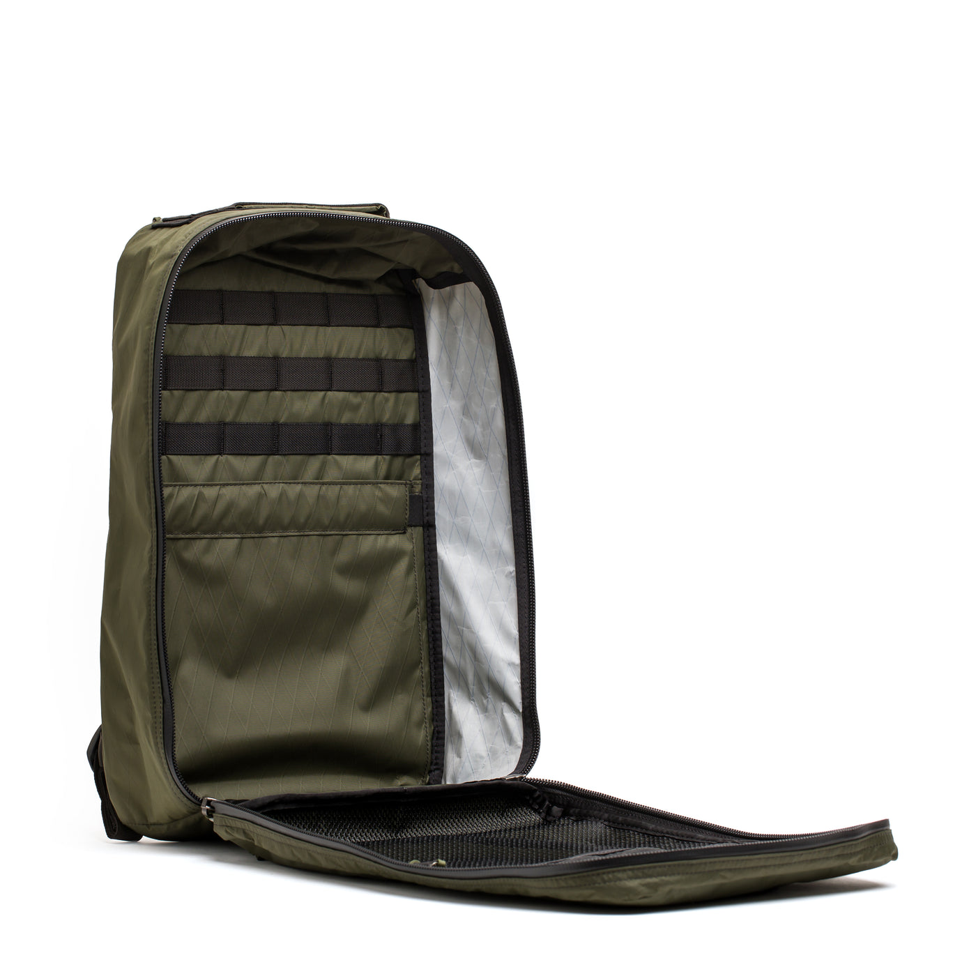 Explore the GR1 USA - X-PAC by GORUCK, an ultra-durable olive green backpack constructed with X-PAC technology. It includes multiple compartments and a sleek black zipper, ensuring your essentials remain protected in style with its waterproof design.