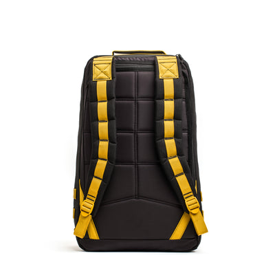 Black GORUCK backpack with yellow straps, featuring the iconic design of the GR1 USA - Cordura (The Original Ruck), viewed from the back.