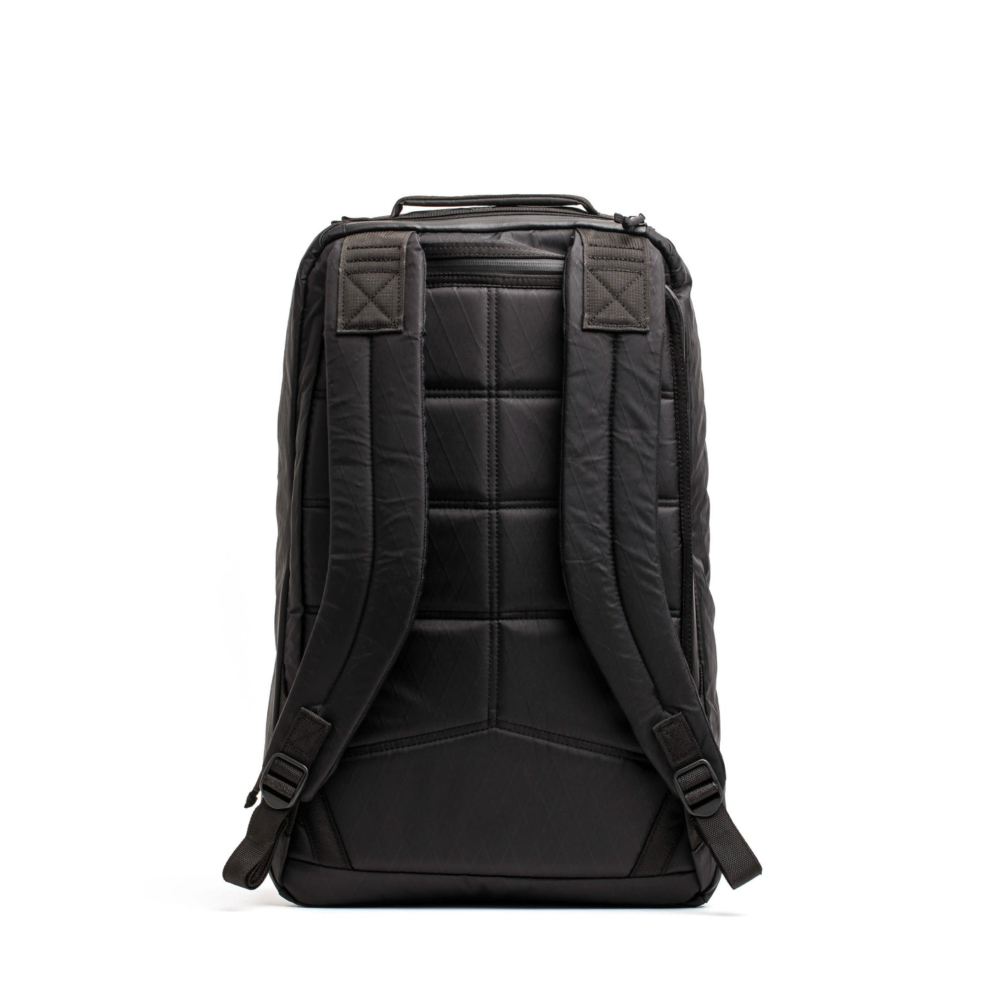 The GR1 USA - X-PAC by GORUCK is a black rucksack designed with padded shoulder straps and a quilted back panel for ultimate comfort. This sleek and minimalistic bag is crafted from waterproof materials, featuring a sturdy top handle and adjustable straps.