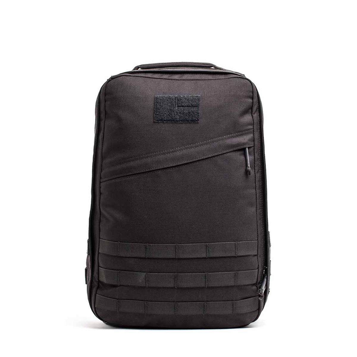 The GR1 USA Throwback is a black tactical backpack made from durable 1680 ballistic nylon, featuring a bombproof laptop compartment, front zipper pocket, horizontal strap details, and a top handle.