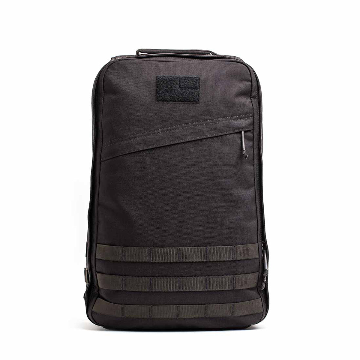 The GR1 USA Throwback is a durable black tactical backpack made from 1680 ballistic nylon. It offers multiple compartments, a bombproof laptop compartment, and features a front Velcro patch for added functionality.