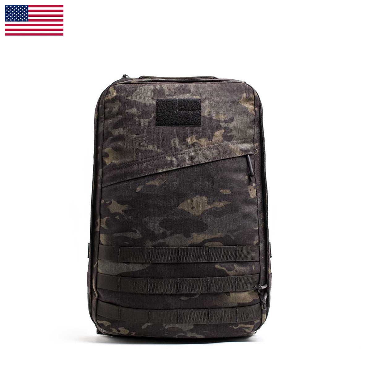 The GR1 USA - Cordura backpack, made with Special Forces-grade materials, features webbing and velcro patches. Displayed against a white background with a small US flag, it’s ideal for your next GORUCK Challenge.