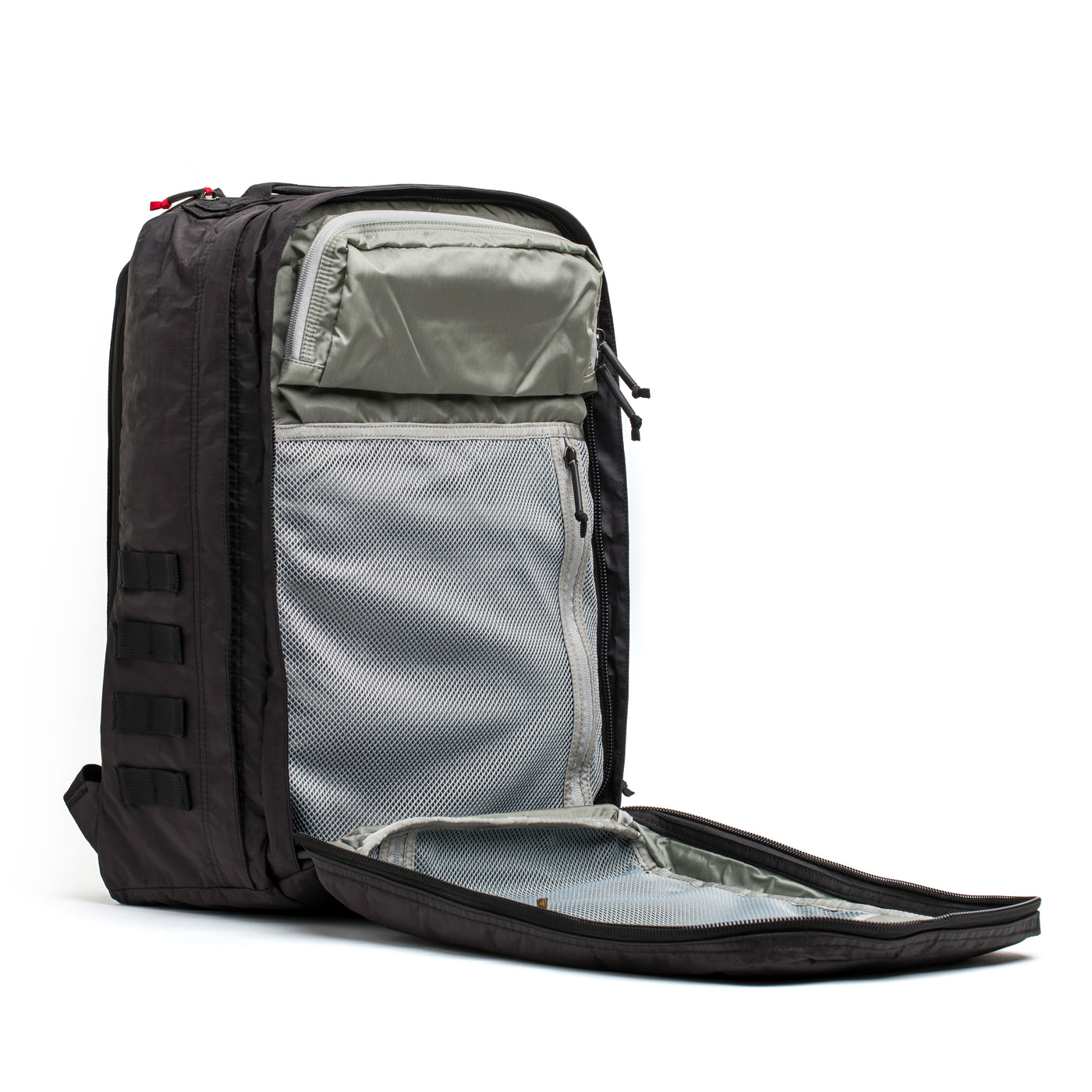 The GORUCK GR2 - Dyneema backpack, crafted with abrasion-resistant material, offers multiple compartments. It includes a grey interior lining and mesh pockets for organized storage and stands upright against a plain white background.