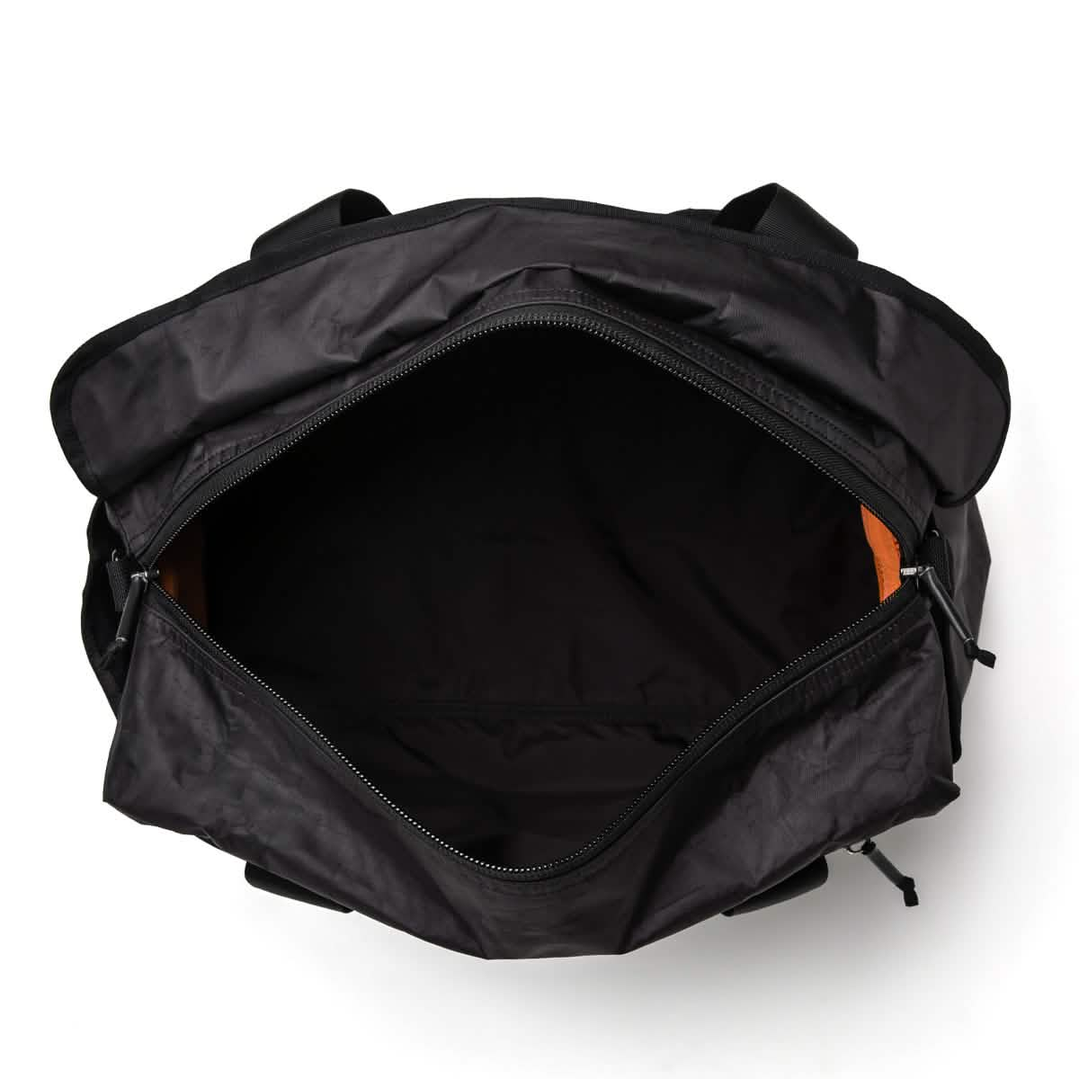 Top view of an open Kit Bag - Dyneema by GORUCK, echoing the design of an Aviator's Kit Bag, featuring a roomy interior. The unzipped zipper reveals the empty bag inside. It has two side handles and sits against a plain white background.