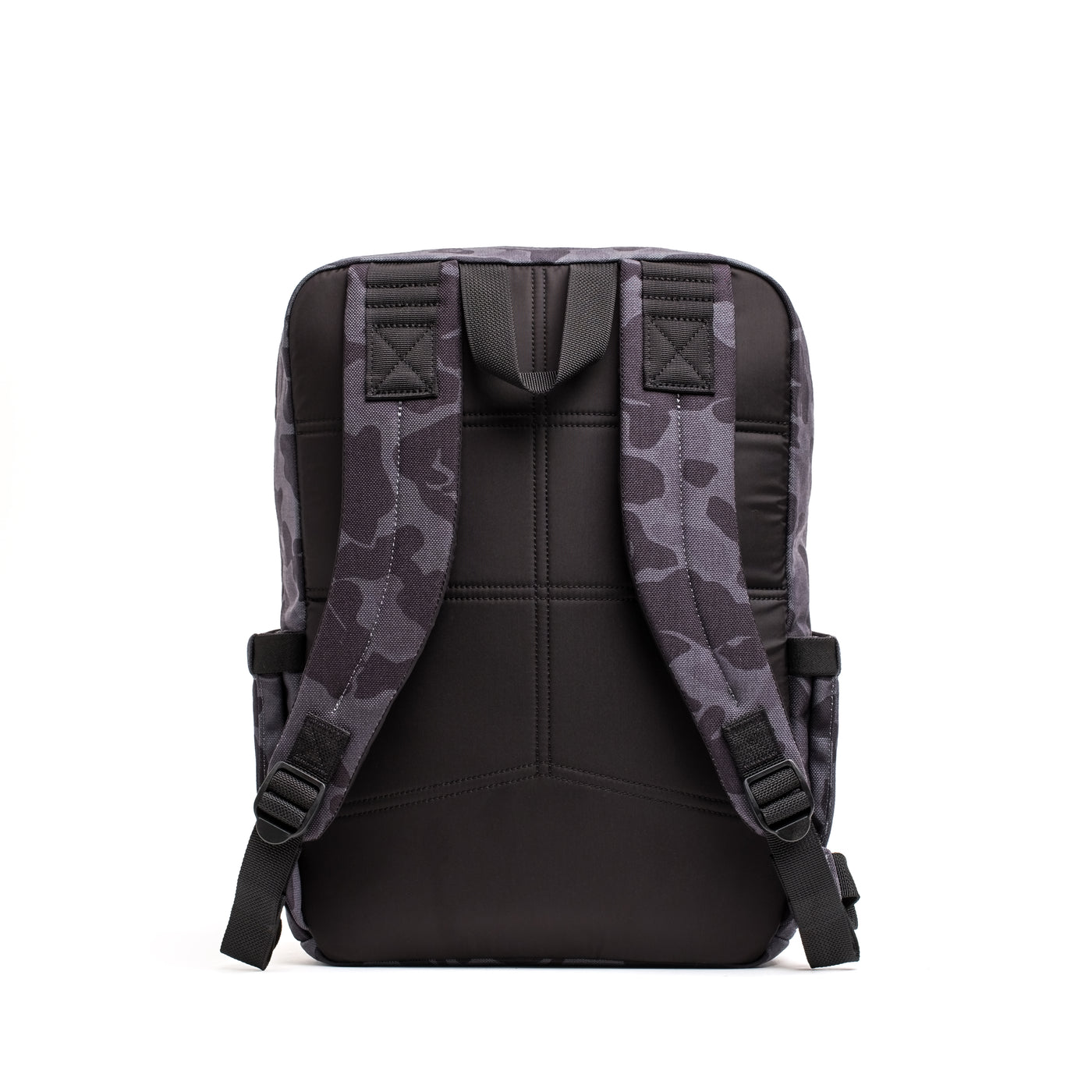 The KR1 2.0 - Kid Ruck by GORUCK is a durable backpack for kids, showcasing a black and gray camouflage pattern, reinforced stitching, and padded shoulder straps for added comfort, displayed from the back.