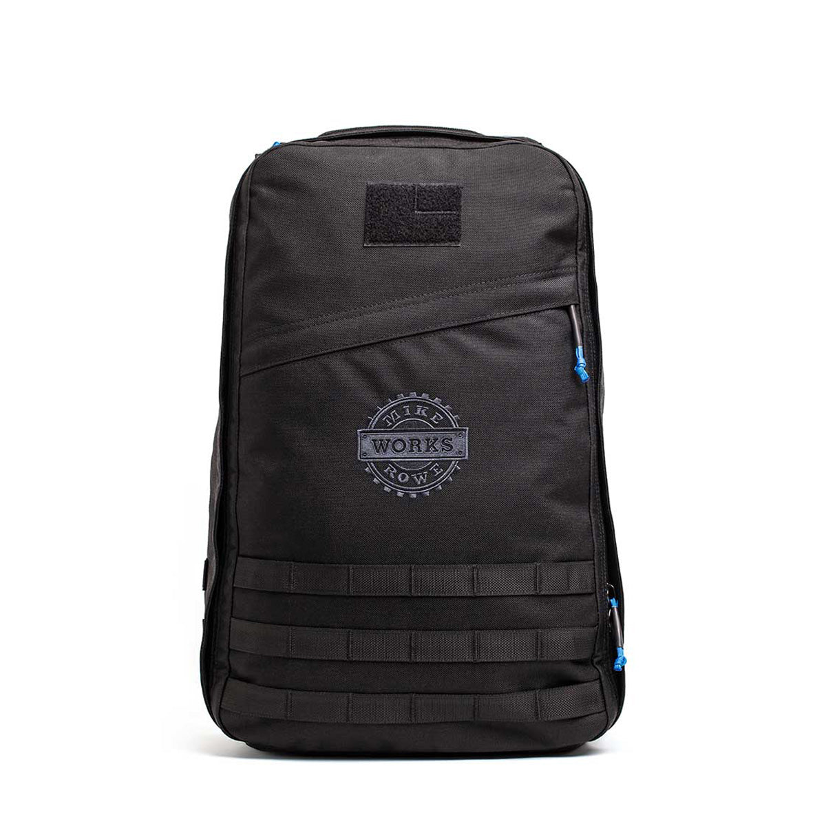 The limited-edition GR1 USA by GORUCK and mikeroweWORKS showcases a black minimalist design, blue zipper accents, and a circular "WORKS" logo, celebrating American craftsmanship inspired by the foundation's dedication to excellence.