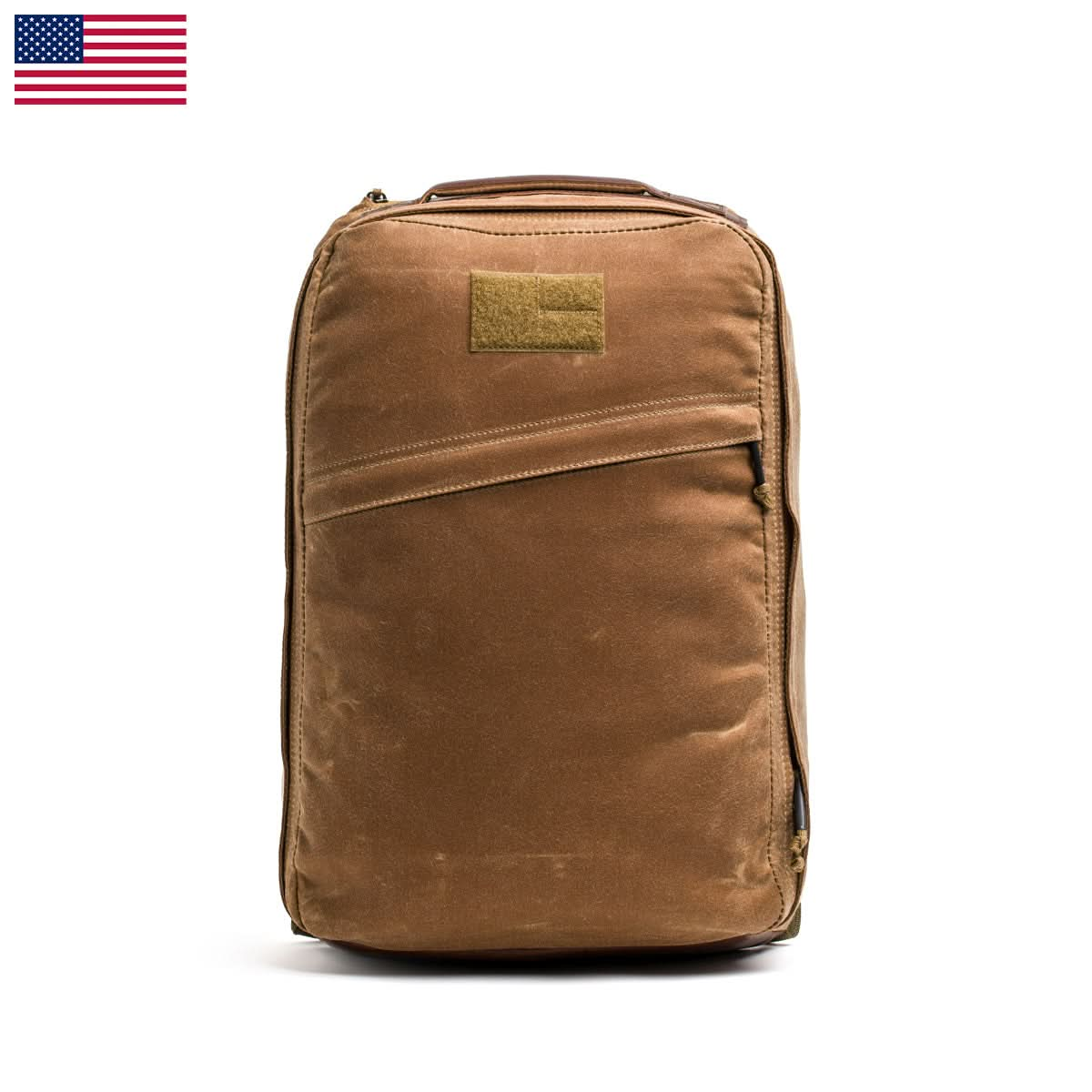 GR1 USA - Heritage rucksack by GORUCK, crafted in waxed duck canvas with a front pocket, shown against a white background with a small US flag in the corner.