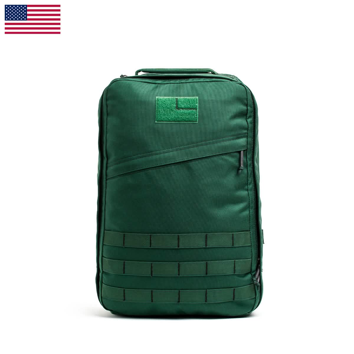 The GR1 USA - Cordura (The Original Ruck) by GORUCK is a green backpack designed for durability and sleek aesthetics, featuring horizontal straps and a subtle flag icon in the top left corner. Inspired by the model used by Special Forces, it is built to withstand any challenge.