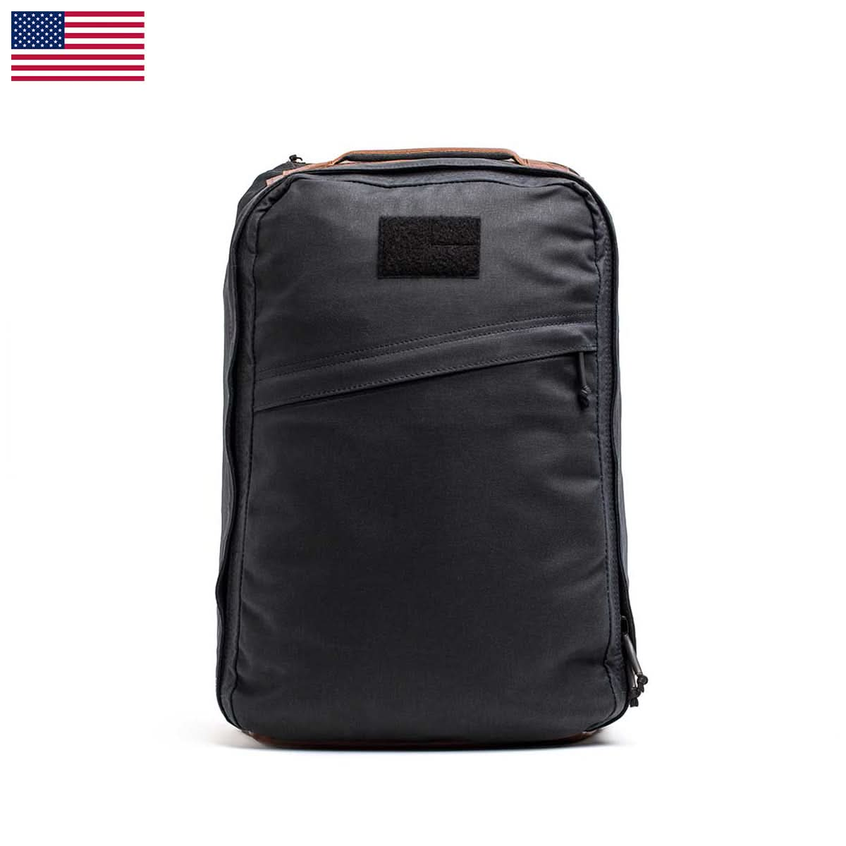 The GR1 USA - Heritage by GORUCK is a minimalist rucksack crafted from waxed duck canvas, set against a white background, and adorned with an American flag in the top left corner.