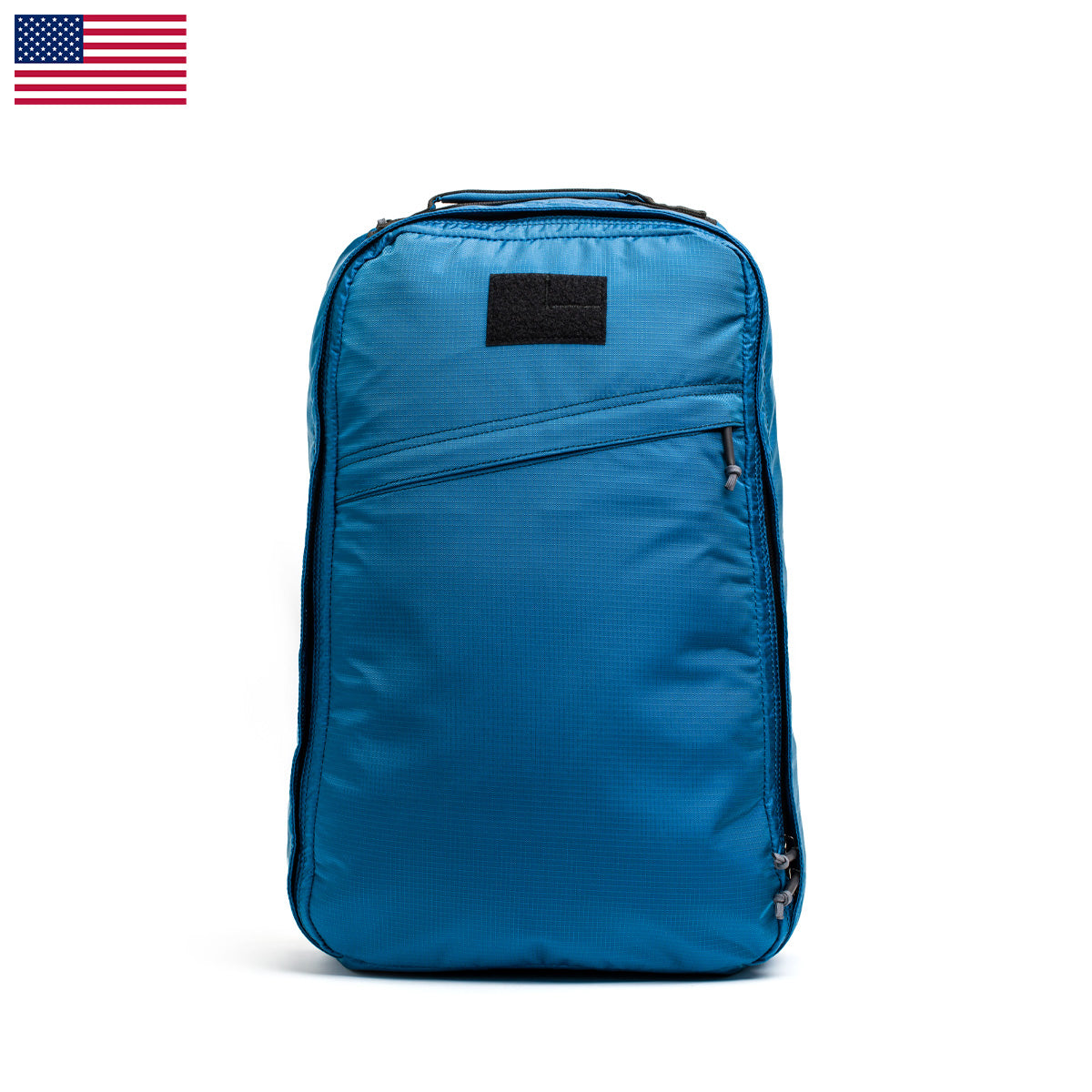 The GR1 USA - Ripstop ROBIC® travel rucksack by GORUCK stands upright, showcasing multiple zippers, an ultra-lightweight design, and a USA flag icon in the top left corner.