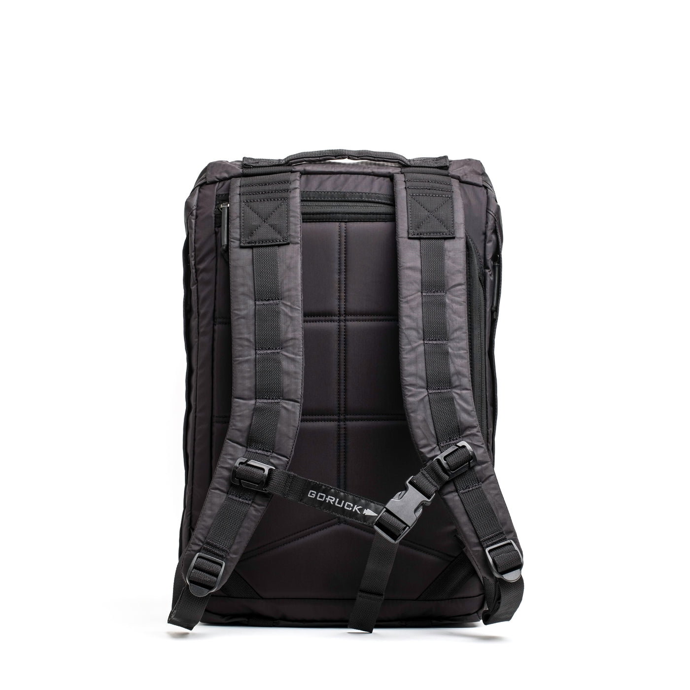 The M23 - Dyneema backpack from GORUCK stands upright, featuring padded shoulder straps and a back panel consistent with the GORUCK standard. Its design incorporates adjustable chest and waist straps for a contemporary rucksack vibe. The rugged look is accentuated by visible stitching and durable buckles.