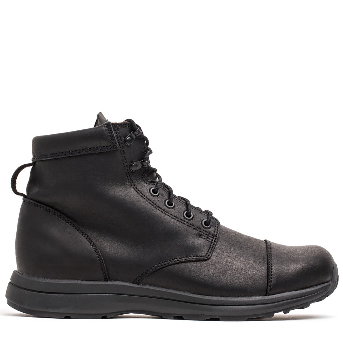 The MACV-1 Traveler x Carryology - Berserker Viking by GORUCK is a black leather ankle boot with laces, showcasing a smooth finish and a sturdy sole, crafted with water-resistant leather for enhanced durability.