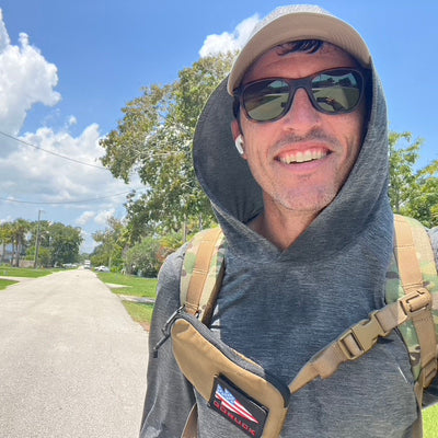 Co-Founder, Jason rucking while wearing the Men's Sun Hoodie - ToughMesh in Charcoal