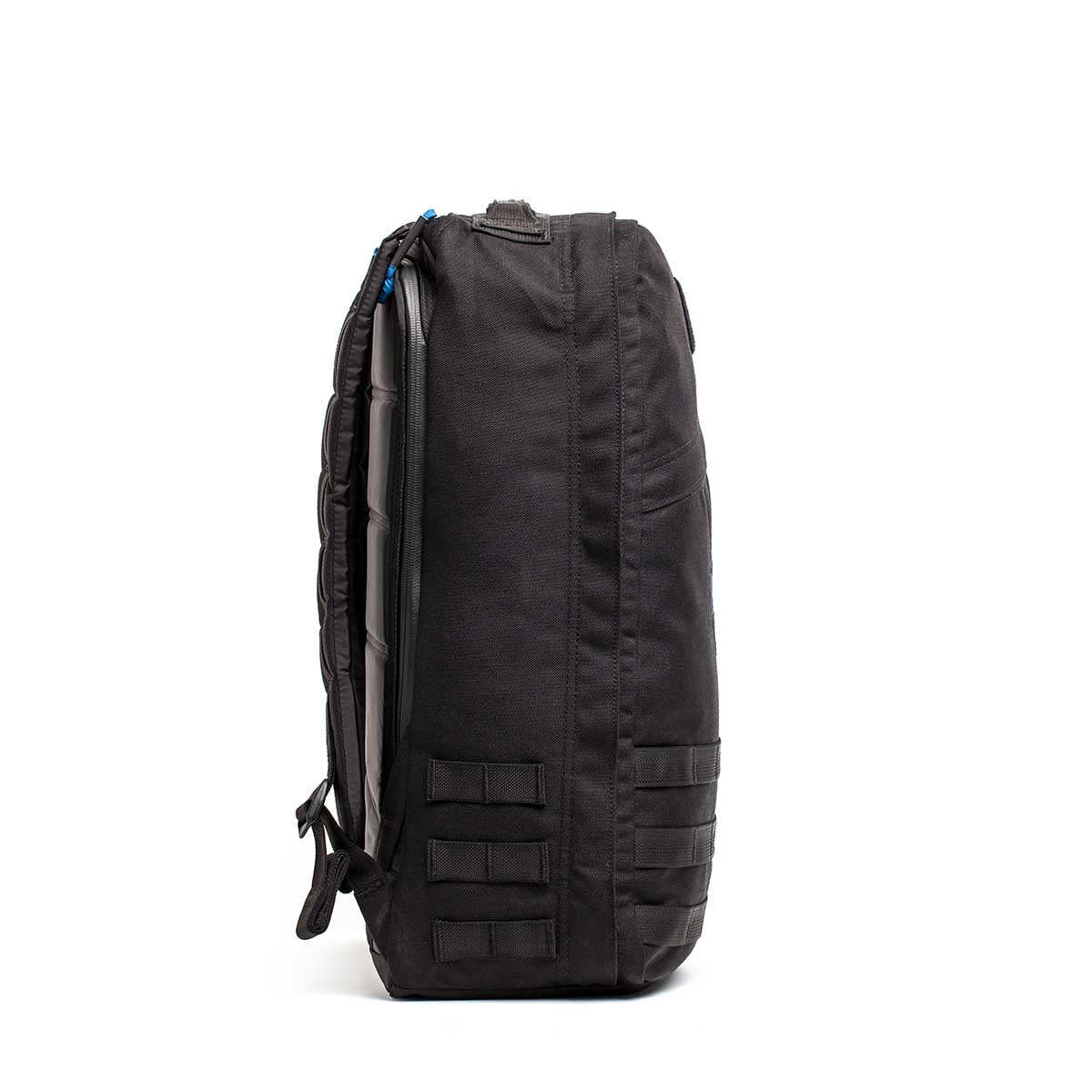 Side view of a black GORUCK X mikeroweWORKS Bundle backpack, featuring rugged horizontal straps and a top handle, against a white background—ideal for demanding tasks or supporting the mikeroweWORKS Foundation.