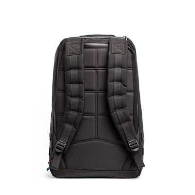 The GORUCK X mikeroweWORKS Bundle includes a black backpack, perfect for tough tasks, with padded shoulder straps and a quilted back panel, displayed from the rear on a plain background.