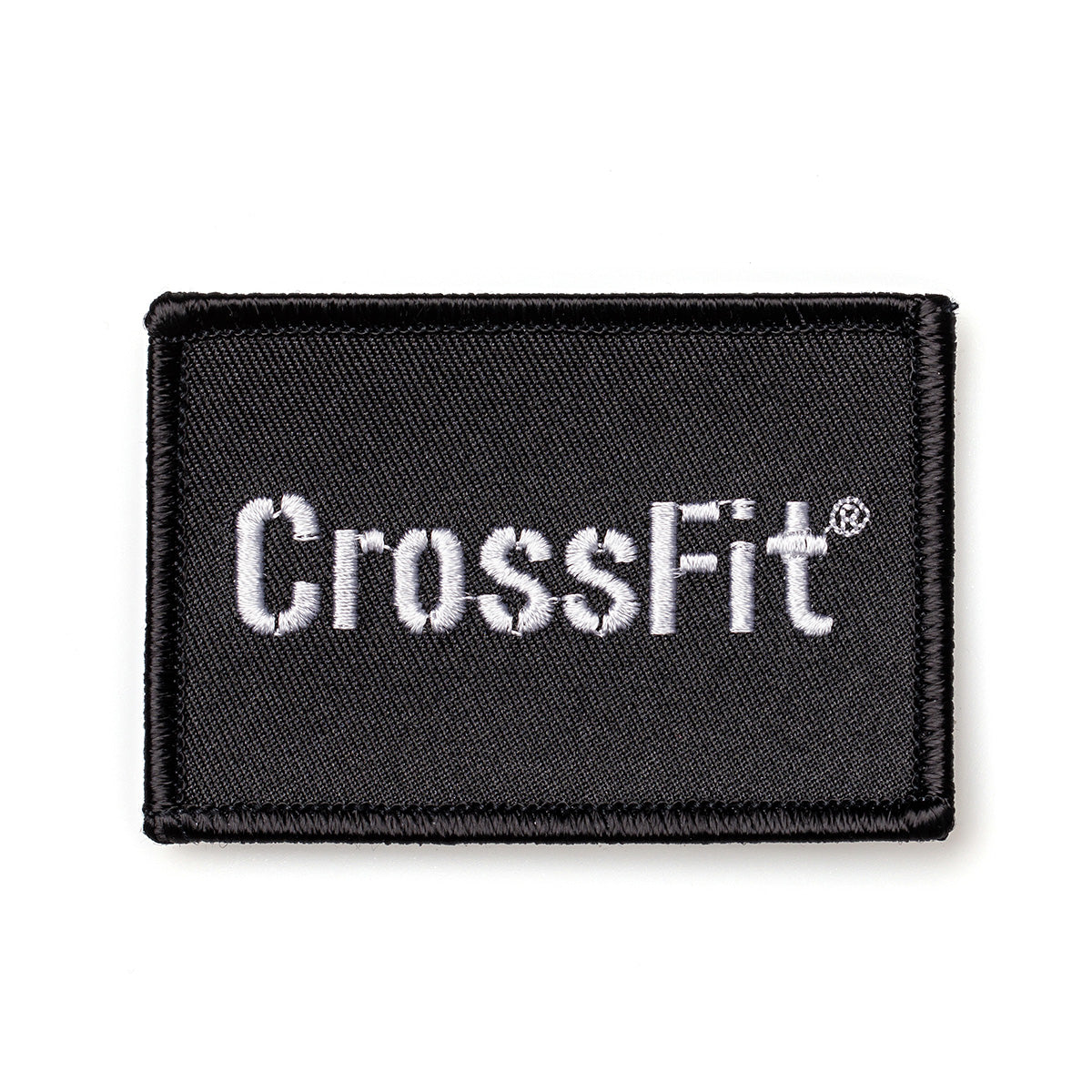 Rectangular black velcro-backed patch with "CrossFit" elegantly embroidered in white, featuring the Patch - CrossFit Stencil from GORUCK-DEMO.